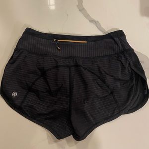 Lululemon racing shorts 2.5” inseam with gold stripped detailing and back zipper